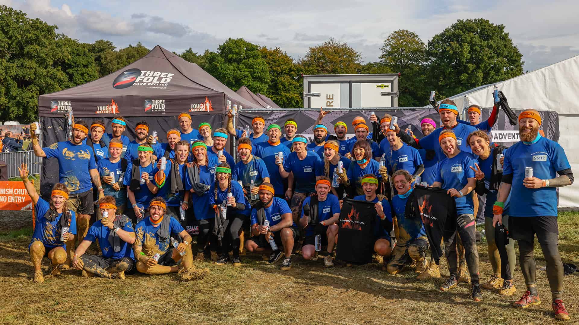 Group photo of the Stark team at tough mudder